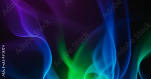 Abstract green, blue, and purple flames on a black background.