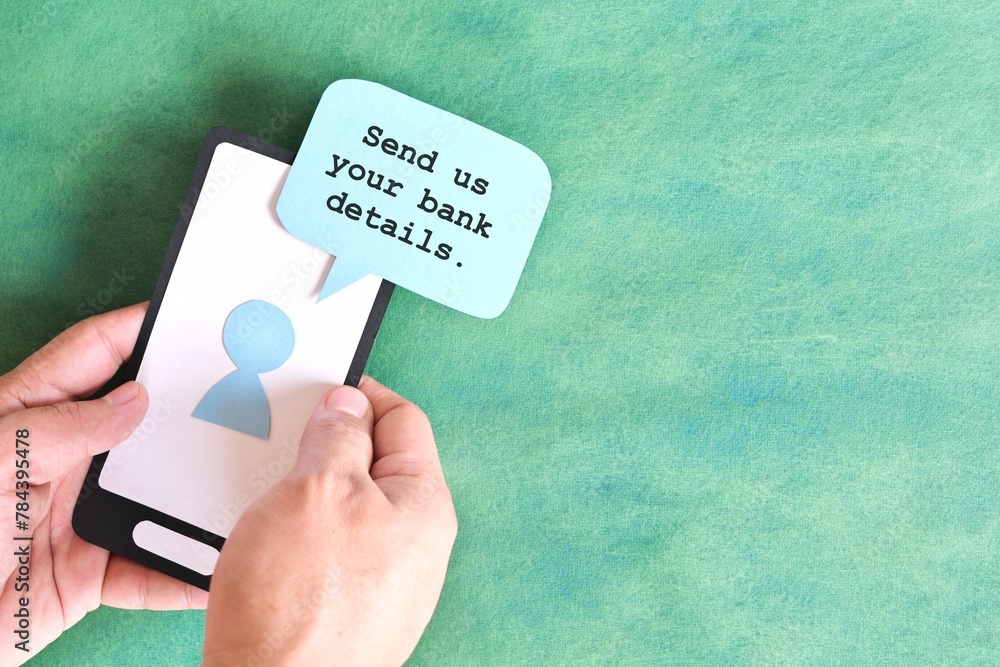 Send credit card bank details text message smishing scam concept. Hand holding mobile phone with message from unknown sender.
