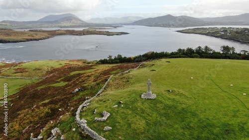 Scenic landscape with green fields and a sea shore during daytimen photo