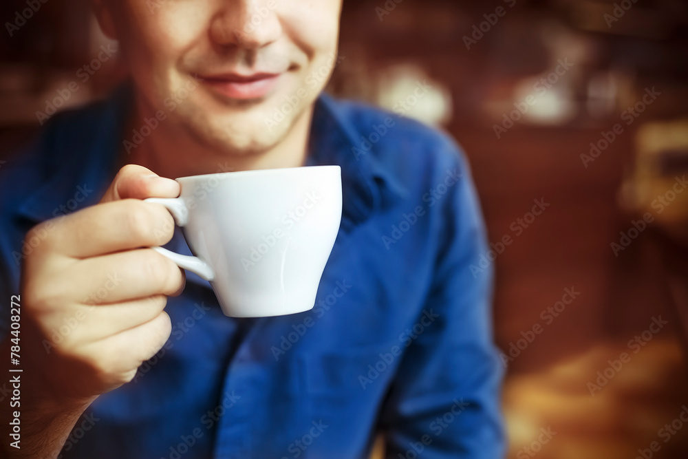 Man drinking white tea cup in cafe Man drinking white tea cup in cafe