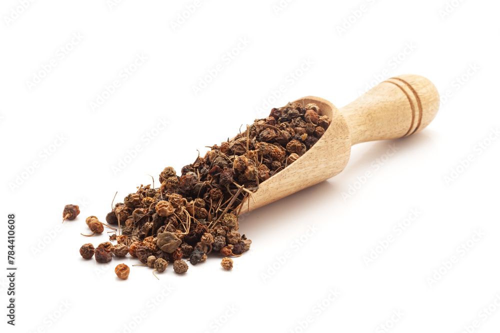 Front view of a wooden scoop filled with Organic Black nightshade or Makoy (Solanum nigrum) fruit. Isolated on a white background. Front view of a wooden scoop filled with Organic Black nightshade or Makoy (Solanum nigrum) fruit. Isolated on a white background.