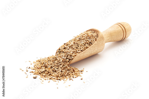 Front view of a wooden scoop filled with Organic Chicory or Kasni (Cichorium intybus) seeds. Isolated on a white background.