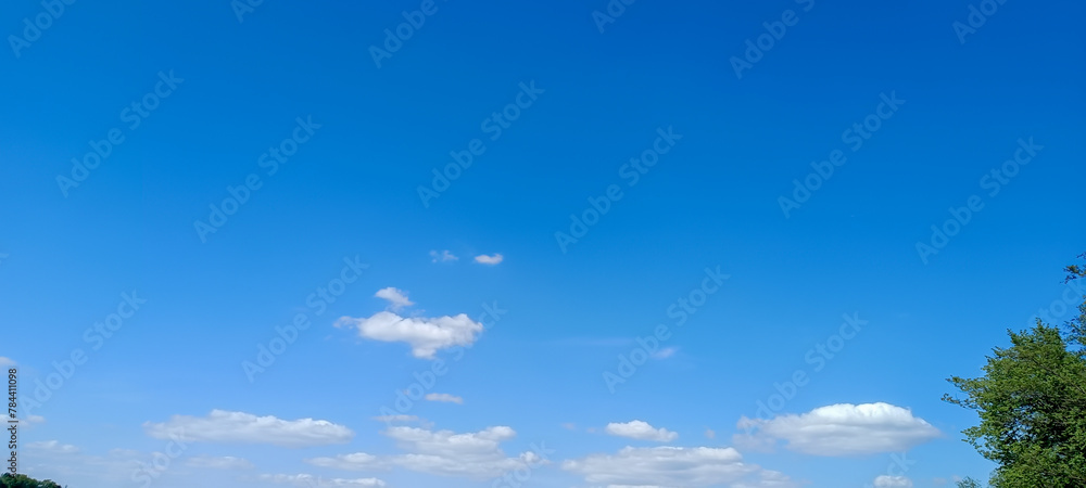 Blue sky background. Natural background. Panorama sky with tiny clouds Blue sky background. Natural background. Panorama sky with tiny clouds