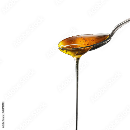 honey on a metal spoon isolated on black and transparent background