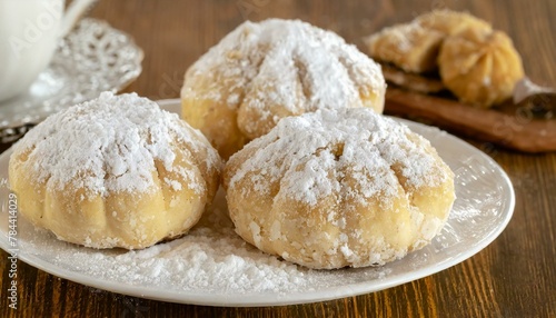 Wallpaper texted Sweets with Tea: Celebratory Maamoul Cookies and Powdered Sugar on Kahk