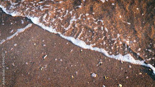 Bild auf Leinwand Sandy beach background with sea waves.
