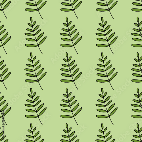 Seamless pattern in wondrous green leaves on green background. Vector image.