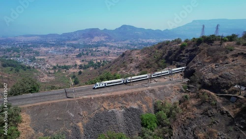 Aerial view of the Solapur Mumbai Vande Bharat Express Train heading towards Mumbai, near Pune India.