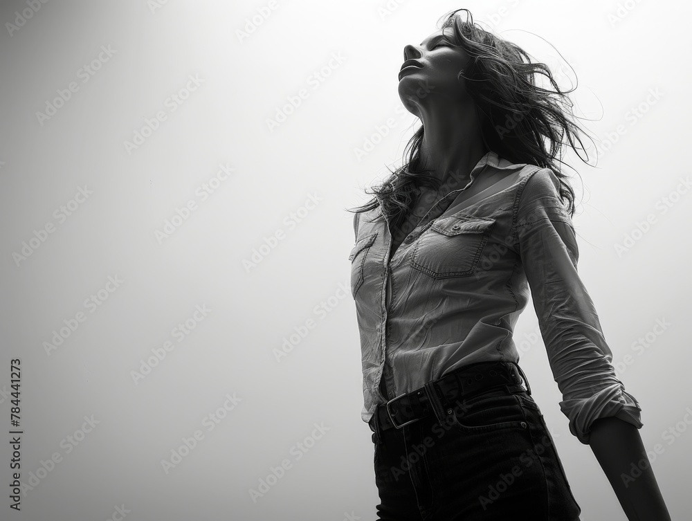 Fototapeta premium Woman with hair blowing in the wind