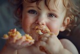 A young child enjoying a piece of cake. Ideal for food and family-themed designs