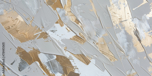 Brush strokes of gold paint on a gray background
