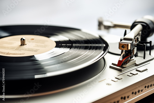 Vintage turntable playing vinyl record, retro music and audio equipment concept. photo