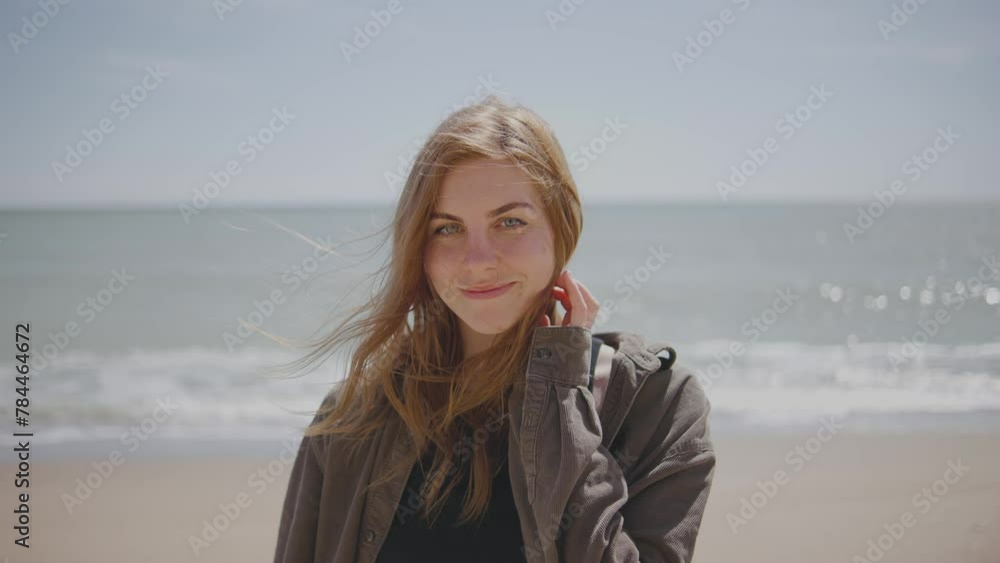 Close up portrait of beautiful young woman smiling on tropical beach slow motion Close up portrait of beautiful young woman smiling on tropical beach slow motion