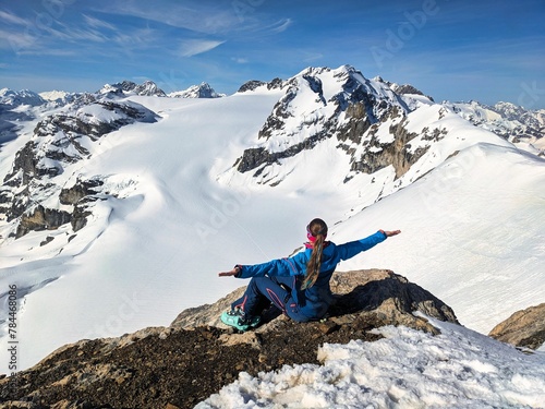 young woman ski touring over the glacier in the Glarus and Uri Alps. Ski tour enjoying the freedom in the Swiss mountains. Ski mountaineering on the Gemsfairenstock and over the Clariden glacier photo