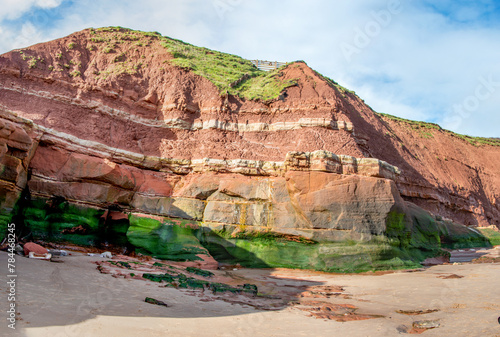 Jurassic strata in cliffs between Exmouth and Budleigh Salterton. Sandstone with clearly visible layers. Geology and fossils. Orcombe point at a world heritage site.  photo