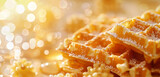 Close-up of a waffle with honey drizzling, showing a shiny glaze.