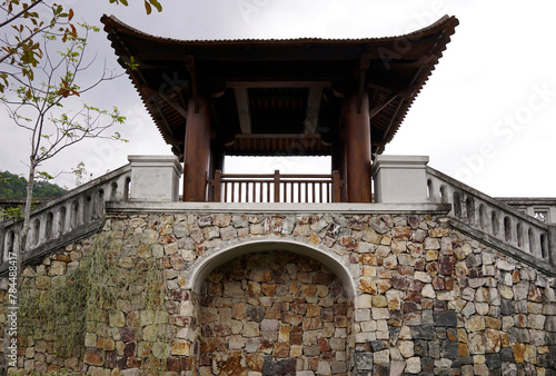 Viewing deck with pagoda inspired architecture and stairs on stone wall