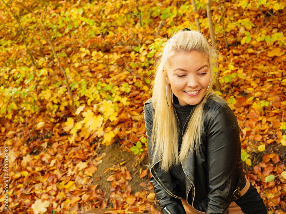 Fashion woman relaxing in autumn park Fashion woman relaxing in autumn park