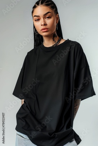 Mockup of a plain black oversized t-shirt on a young woman, ideal for branding and design. photo