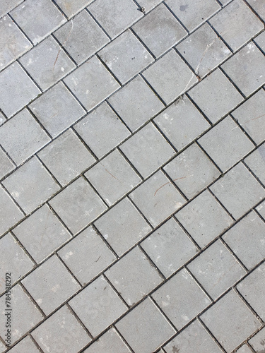 Pavement surface made of stones located diagonally in the frame photo