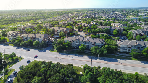 Konstfotografi Suburban neighborhood with water tower, multistory apartment complex, single fam