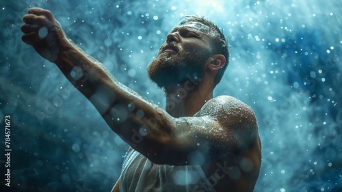 Bearded man in emotional rain scene with blue tones and water droplets in motion, expressing strength and determination.
