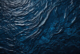 Abstract dark blue texture with deep ocean tones, perfect for creating an atmospheric background or backdrop