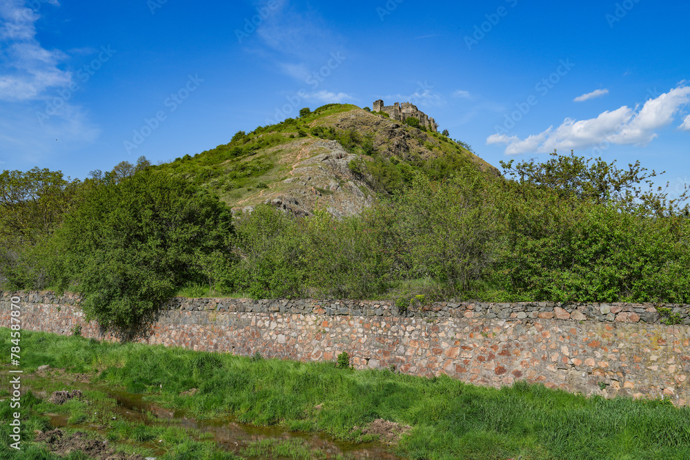 A view of Soimos Fortress with a blue sky in the background, built in 1278 on Mures Valley, Arad county, Romania