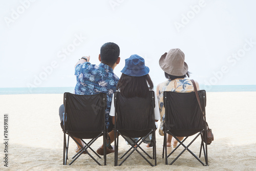 Freedom family on the beach. Mother, daughter and father against sea and sky background with dog. Happy holiday travel concept.