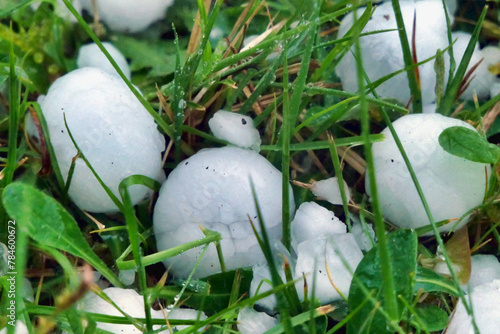 Giant hailstones from a storm (in the Dordogne, France April 2024) resulting in damaged roof tiles and a dented car bonnet and roof
 photo