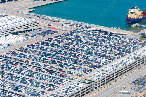 Parking lot at Barcelona seaport, top view of the large number of parked cars.
