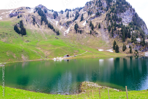 View of the Lake Hinterstocken at the foot of Stockhorn peak in Bernese Oberland, Switzerland photo