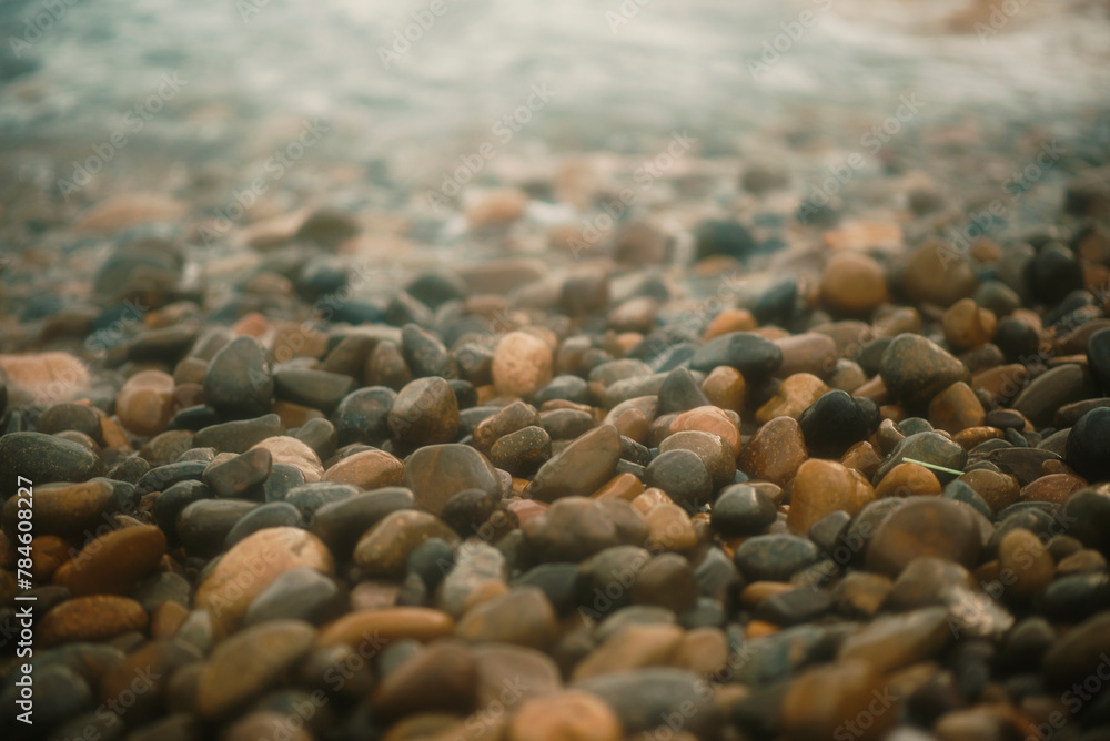 stones on the shore hitting by waves stones on the shore hitting by waves