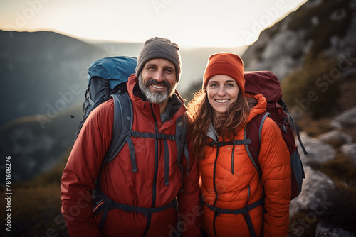 Adult couple at outdoors with mountaineer backpack