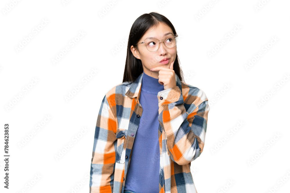 Young Asian woman over isolated chroma key background having doubts and with confuse face expression Young Asian woman over isolated chroma key background having doubts and with confuse face expression