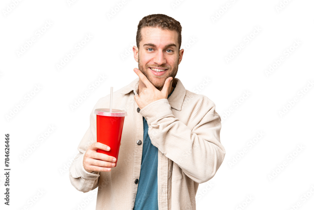 Young handsome blonde man holding soda over isolated chroma key background happy and smiling