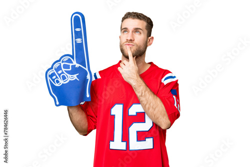 sports fan man over isolated chroma key background having doubts while looking up