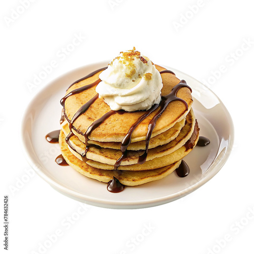 Golden pancakes with cream and chocolate on plate