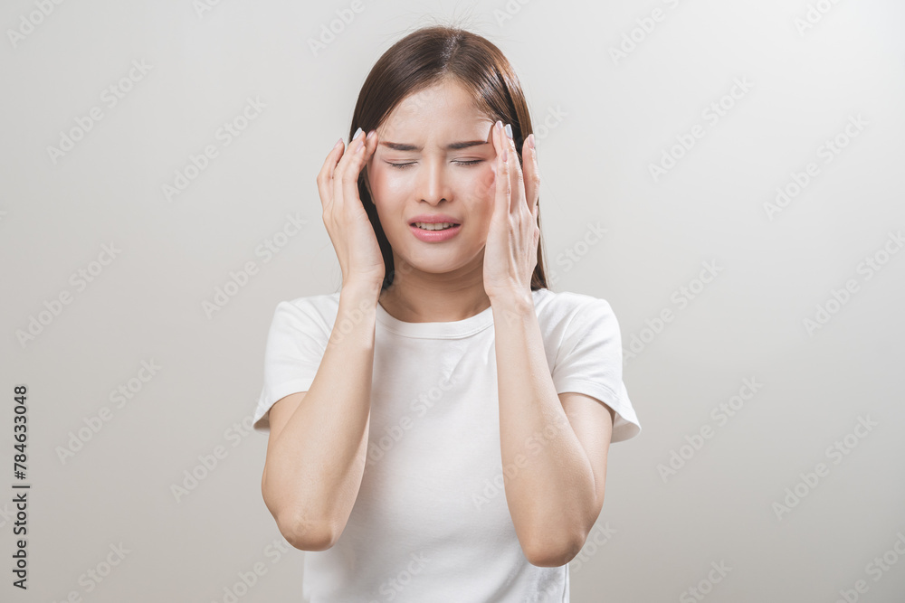 Dizzy asian young woman, girl headache or migraine pain suffering from vertigo while sitting on couch in living room at home, holding head with hand, health problem of brain or inner ear not balance. Dizzy asian young woman, girl headache or migraine pain suffering from vertigo while sitting on couch in living room at home, holding head with hand, health problem of brain or inner ear not balance.