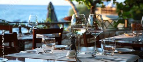 Local wines and ouzo served in classic ceramic or glassware complete the Mediterranean Taverna experience.