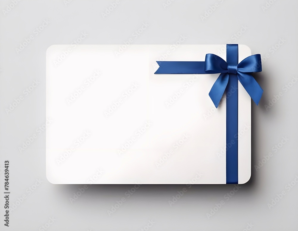 Blank white gift card with blue ribbon bow isolated on background with shadow minimal conceptual Blank white gift card with blue ribbon bow isolated on background with shadow minimal conceptual