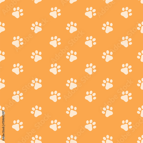 Cat s paws pattern. Seamless pattern with the image of kitten paws. White cat tracks on an orange background. Pattern for print and gift wrapping