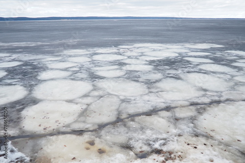 Ice drift in spring on Lake Onega, Karelia. Dangerous thin spring ice in April. Aggregate accumulations of fine-crystalline grains. Opening of small lakes, ponds and reservoirs. Crushed ice floes