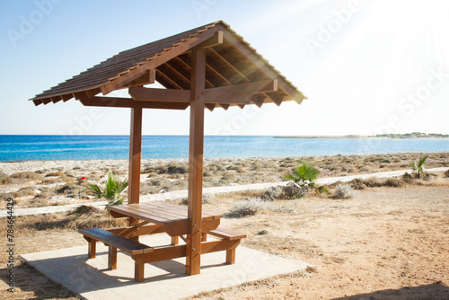 Fototapeta Naklejka Na Ścianę i Meble -  beautiful bench near the sea shore on nature background