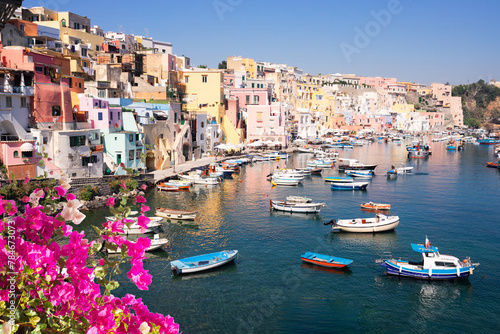 Procida island colorful town with harbor at summer with flowers, Italy photo