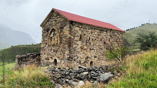 Thaba-Yerdy in Ingushetia. ZEISS, RUSSIA - MAY 19, 2023: Video of the Thaba-Yerdy Temple, the oldest temple in Ingushetia. The Caucasus Mountains. 4K	 photo