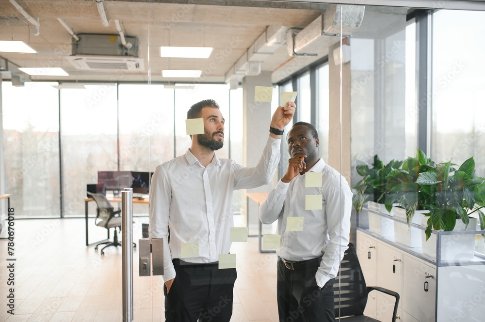 Corporate, sticky notes and business people planning a team mission, project or growth of business plan Corporate, sticky notes and business people planning a team mission, project or growth of business plan