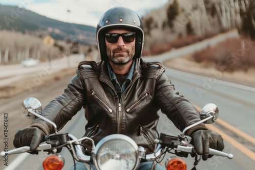 Confident Biker in Leather Jacket Cruising on Highway Road Trip