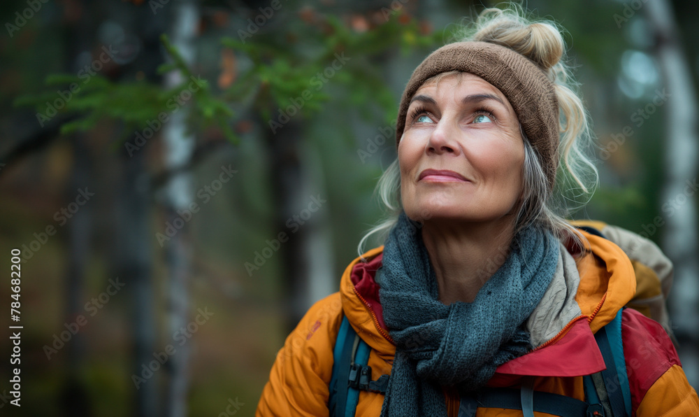 50 year old woman, going for a hike, beautiful wilderness, looking up and feeling inspired, photo realistic, high angle, 35mm lens, Hyper realistic photo. very detailed 50 year old woman, going for a hike, beautiful wilderness, looking up and feeling inspired, photo realistic, high angle, 35mm lens, Hyper realistic photo. very detailed