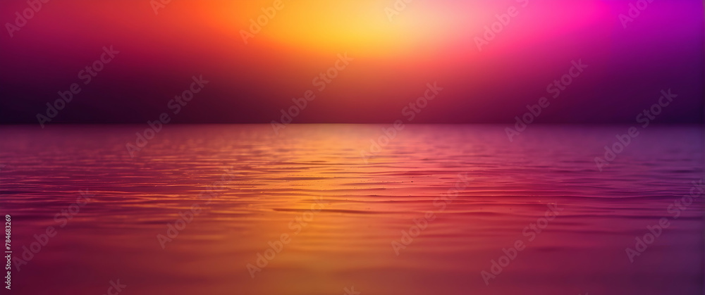 Obraz premium A captivating image presenting a dramatic sunset with vibrant pink and orange hues reflecting beautifully on the water's surface